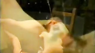 Horny milf peeing on her own face