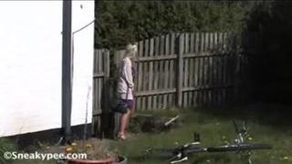 Busty blonde peeing in a bucket