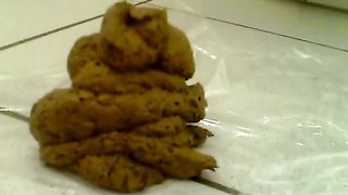 Holding her ass while pooping