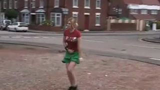 Skinny blonde peeing behind garage