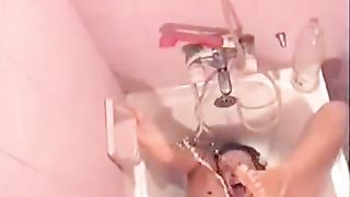 Brunette teen peeing on her own face