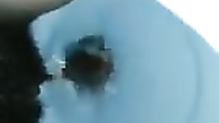 Fat ebony shitting in toilet