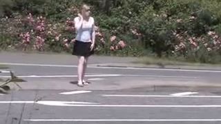 Blonde teen peeing on the side of the road
