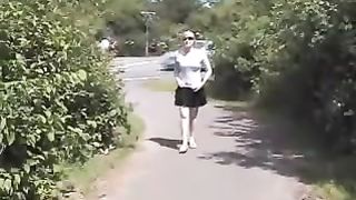 Blonde teen peeing on the side of the road