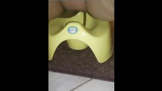 Fat mother shitting in a potty