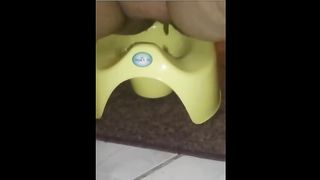 Fat mother shitting in a potty