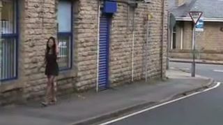 Dark haired girl peeing outdoor
