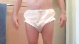 Amateur girl shitting in pink plastic panties