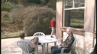 Two girls peeing on a plastic table