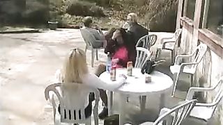 Two girls peeing on a plastic table