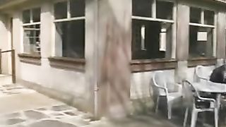 Two girls peeing on a plastic table