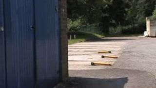 Hot Asian girl peeing behind big garage