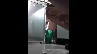 Playing with her pussy while pooping