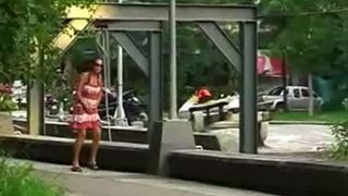 Dark haired teen peeing in the streets