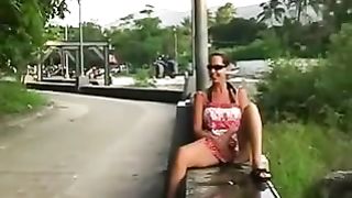 Dark haired teen peeing in the streets