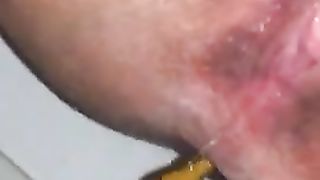 Shaved wife shitting in close up