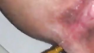 Close up of amateur girl pooping in toilet