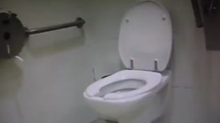 Young girl shitting over toilet