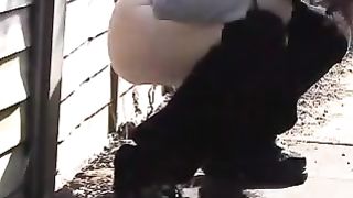 Redhead babe peeing in public