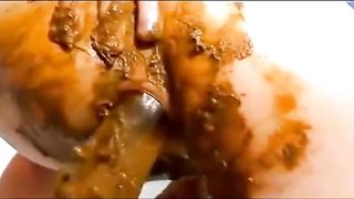 Fisting her scat pussy