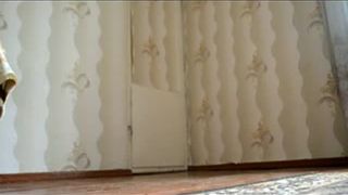 Masked dark haired girl smears crap on her ass