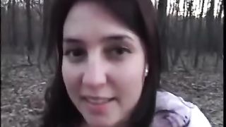 dark haired babe shitting in the woods
