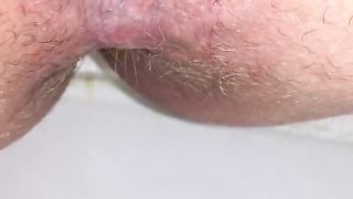 Shaved wife shitting in close up