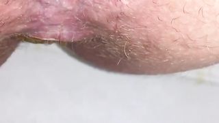 Shaved wife shitting in close up