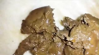 Smearing shit from her ass