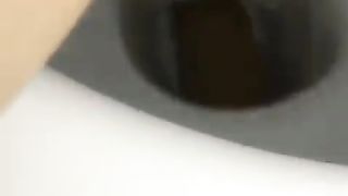 Shaved girl pooping in toilet