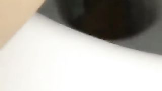 Shaved girl pooping in toilet