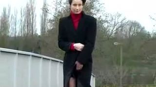 Dark haired girl peeing in public