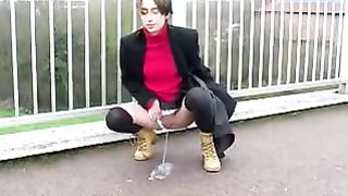 Dark haired girl peeing in public
