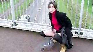 Dark haired girl peeing in public