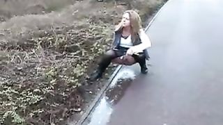 Sexy babe peeing on sidewalk