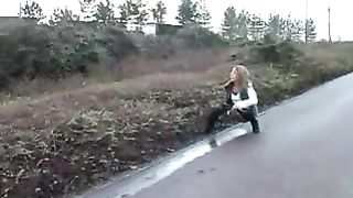 Sexy babe peeing on sidewalk