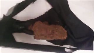Beautiful babe shits in black panties