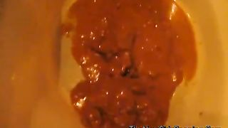 Mature woman pooping