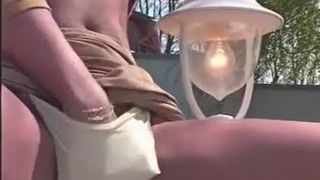 Beautiful girl peeing outdoor