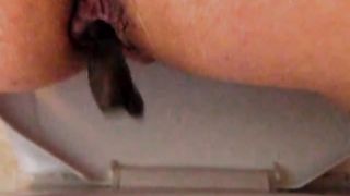 Hot babe shitting on bathroom floor