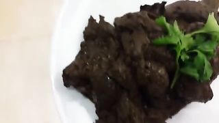 Dark haired girl pooping on white plate