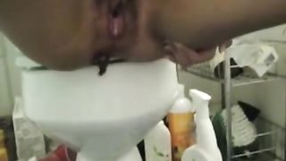 Hairy girl pooping on bathroom floor