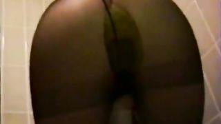 Asian shitting in black pantyhose