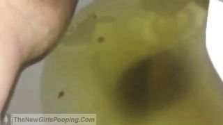 Shaved girl pooping in close up