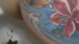 Girl with tattooed ass pooping