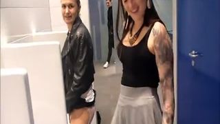 Two girls peeing in unique way