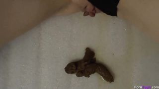 Beautiful blonde babe shitting while masturbating