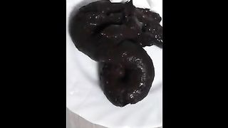 Masturbating while shitting on a plate