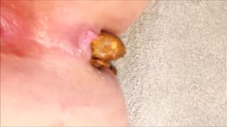 Shaved girl shitting on bedroom floor