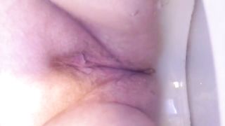 Hairy mature woman shitting in close up